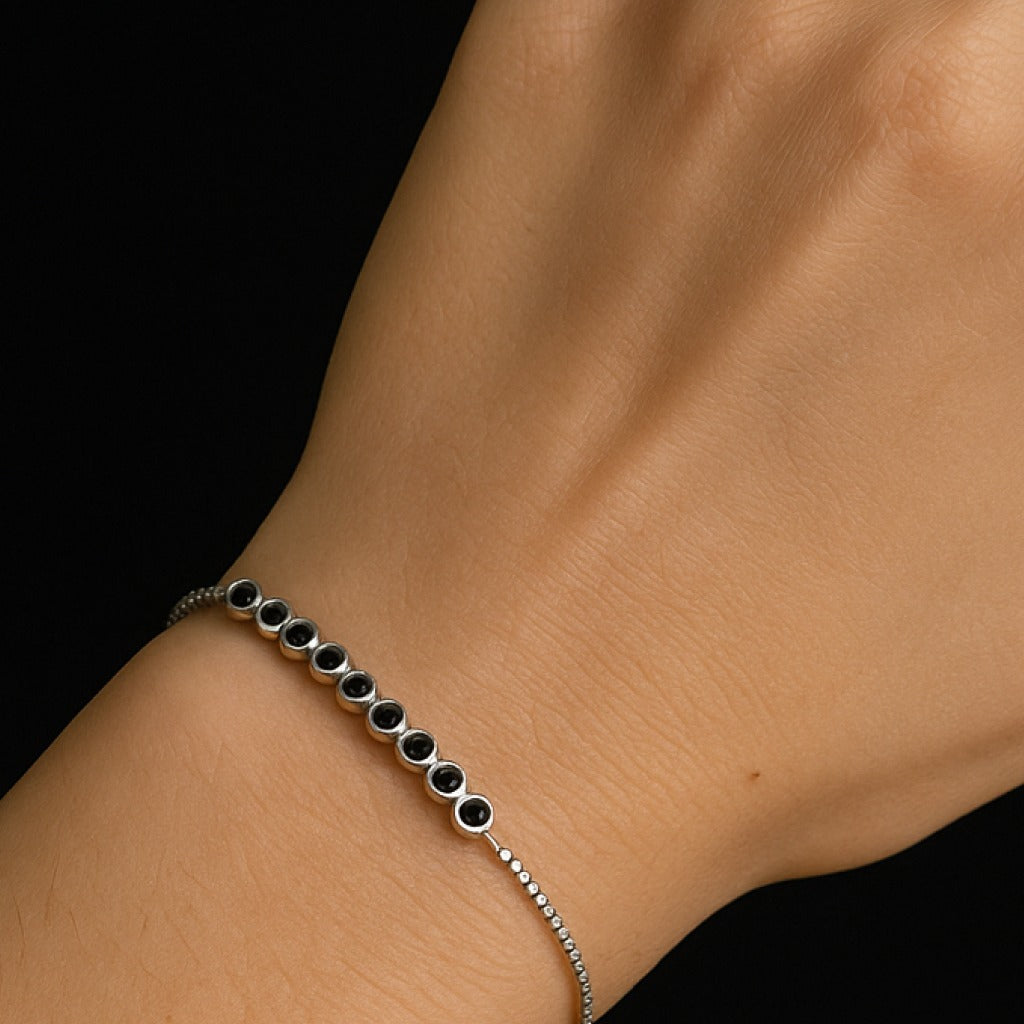 Sleek bracelet with round black moissanite dimond bracelet